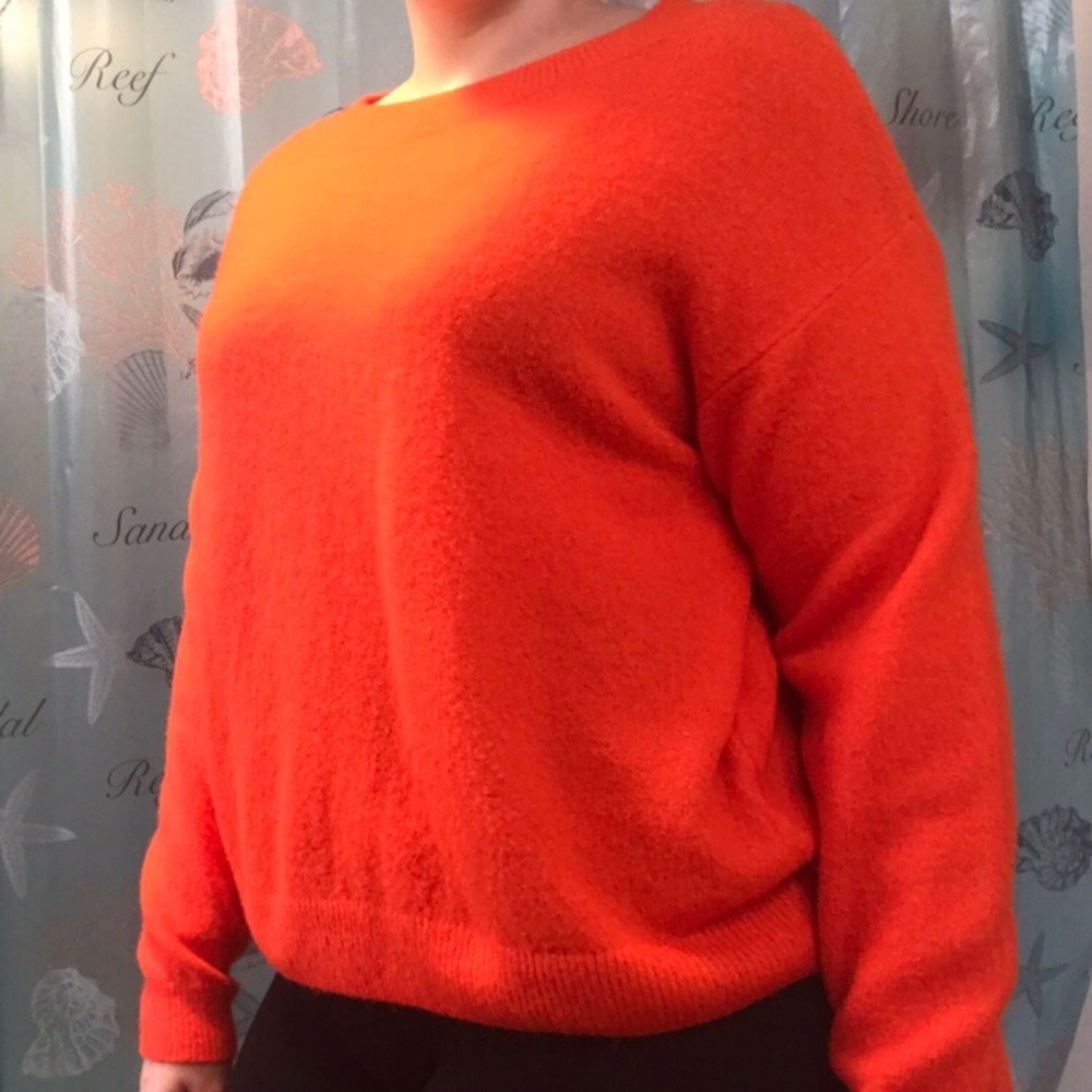 Wide-cut orange sweater